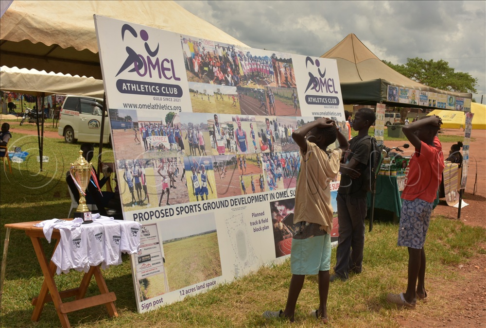 Boys viewing a photo collection on display at Kaunda Grounds.