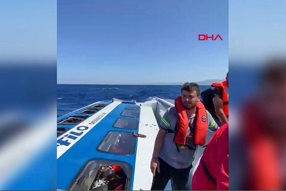 This screen grab image taken from UGC handout video courtesy of DHA on August 30, 2026, shows passengers waiting to be rescued at sea following the sinking of the ferry they were traveling on after it left the port of Kyrenia in the self-proclaimed Turkish Republic of Northern Cyprus (TRNC), recognised only by Turkey, in the north of the divided Mediterranean island of Cyprus. (Credit: AFP)