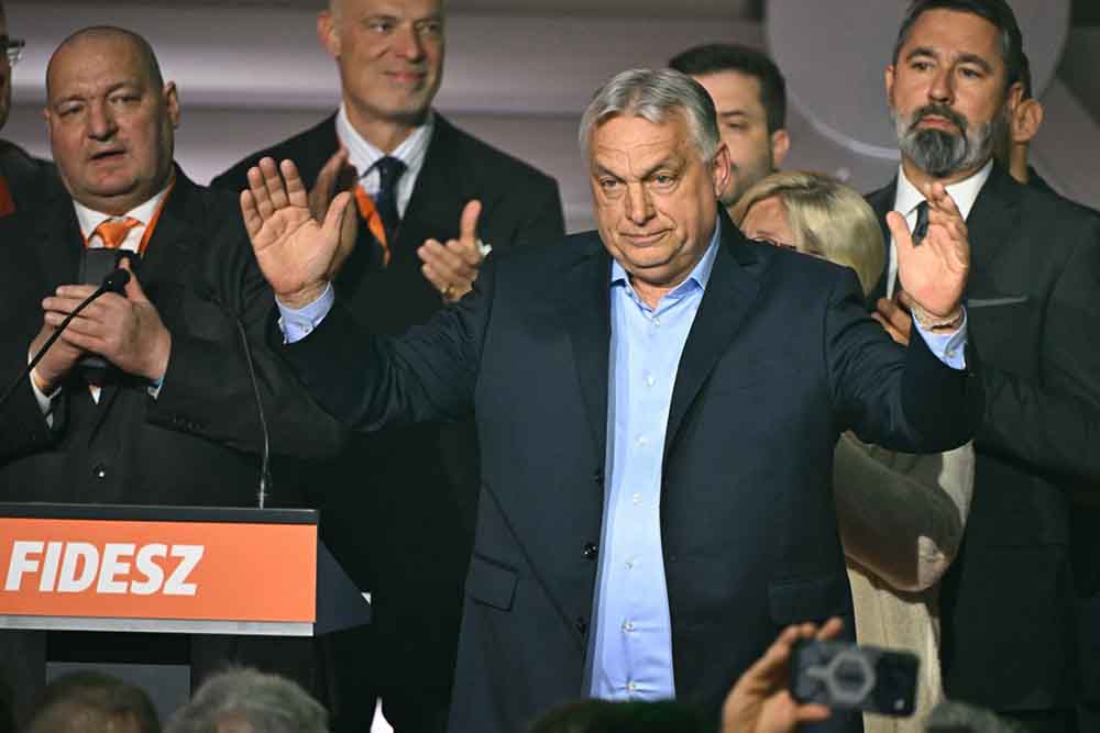 Hungary's Prime Minister Viktor Orban salutes to supporters at the Balna centre in Budapest during a general election in Hungary, on April 12, 2026. (Credit: AFP)