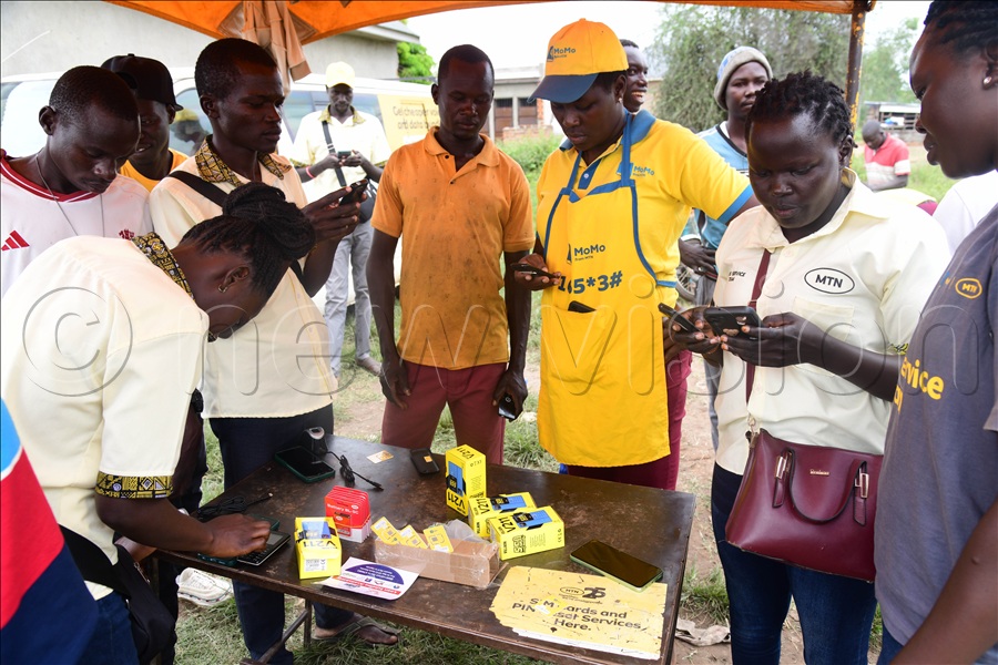 People registering for MTN SIM cards at the telecom tent.