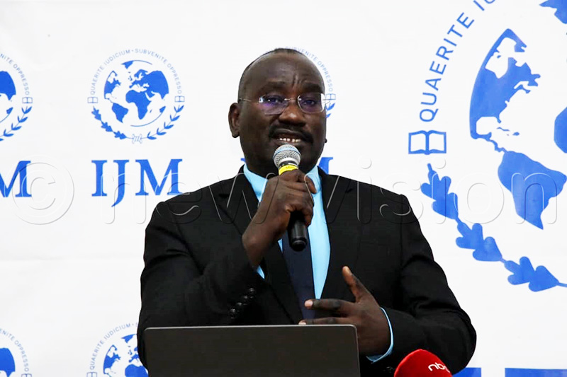 Dr Daniel Kibuuka Musoke presenting the findings in the International Justice Mission (IJM) Uganda Violence Against Women and Children (VAWC) National Baseline Report. (Photo by Mpalanyi Ssentongo)