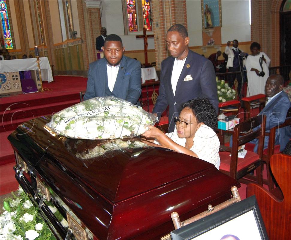 Lady Margaret Kyabaggu, wife of the late Prince Dr. Paul Mawanda Kyabaggu kneels down as she lays a wreath on the casket containing her husband's remains during the requiem mass at Lubaga Cathedral on Wednesday, September 24. 2025. 