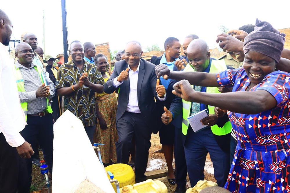 The minister commissioned several flagship investments, including the rehabilitated Kajamaka Earth Dam, a rice processing and storage facility in Kanyum town council, and the first piped water system on Tisai island. (Courtesy Photo)