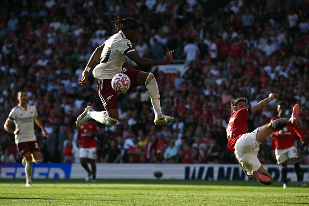 Arsenal's English defender #20 Noni Madueke fails to connect with the ball during the English Premier League football match between Manchester United and Arsenal at Old Trafford in Manchester, north west England, on August 17, 2025. 
