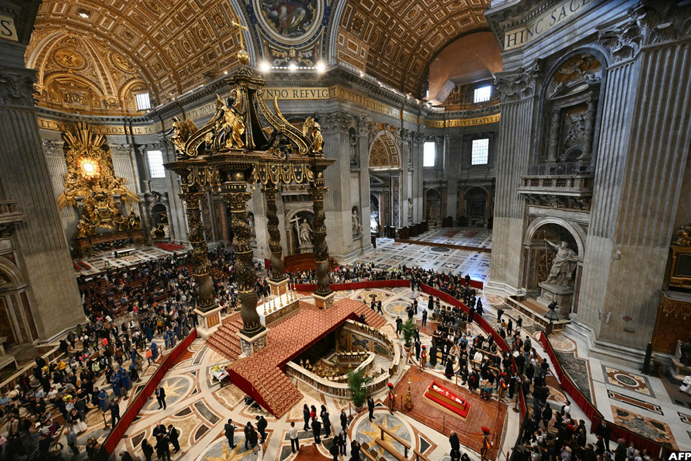 Mourners and visitors pay their respects to late Pope Francis as he lies in state in a coffin at St Peter's Basilica in The Vatican, on April 24, 2025