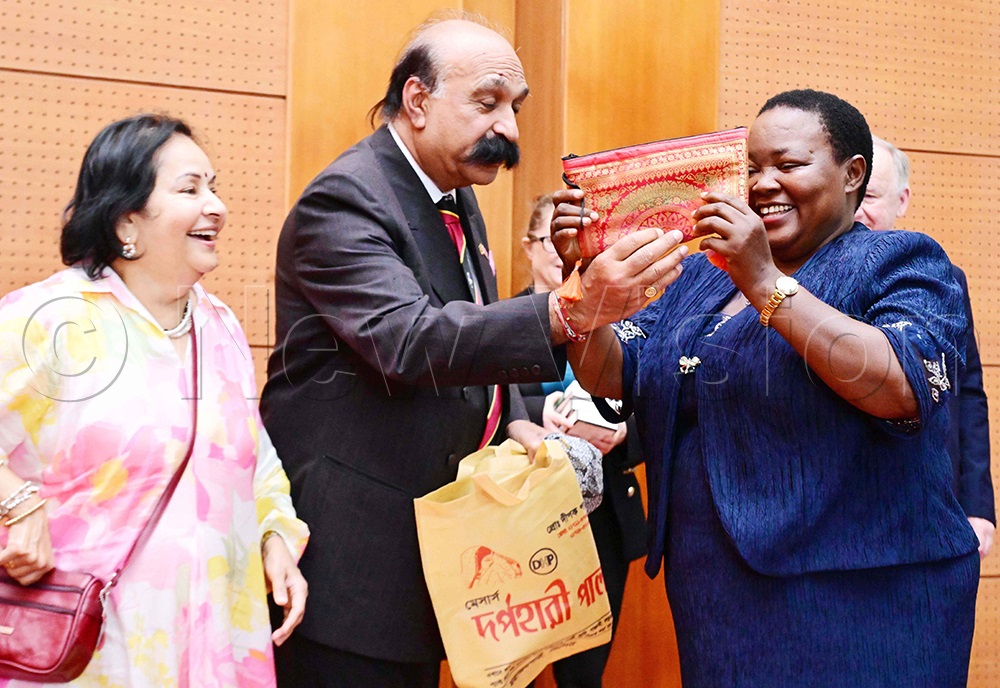 The Prime Minister of Uganda, Rt Hon. Robinah Nabbanja (right), receiving a gift from Dr Manoj Joshi, President, Uganda, Europe, UK Association (UEUKA), as Dr Bhavna Joshi looks on. This was as the Prime Minister received trade and investment delegations from the Westminster Africa Business Association, South Asia Chamber of Commerce and Industry and UAE at OPM on Tuesday, February 17, 2026. (Photo by Mpalanyi Ssentongo)