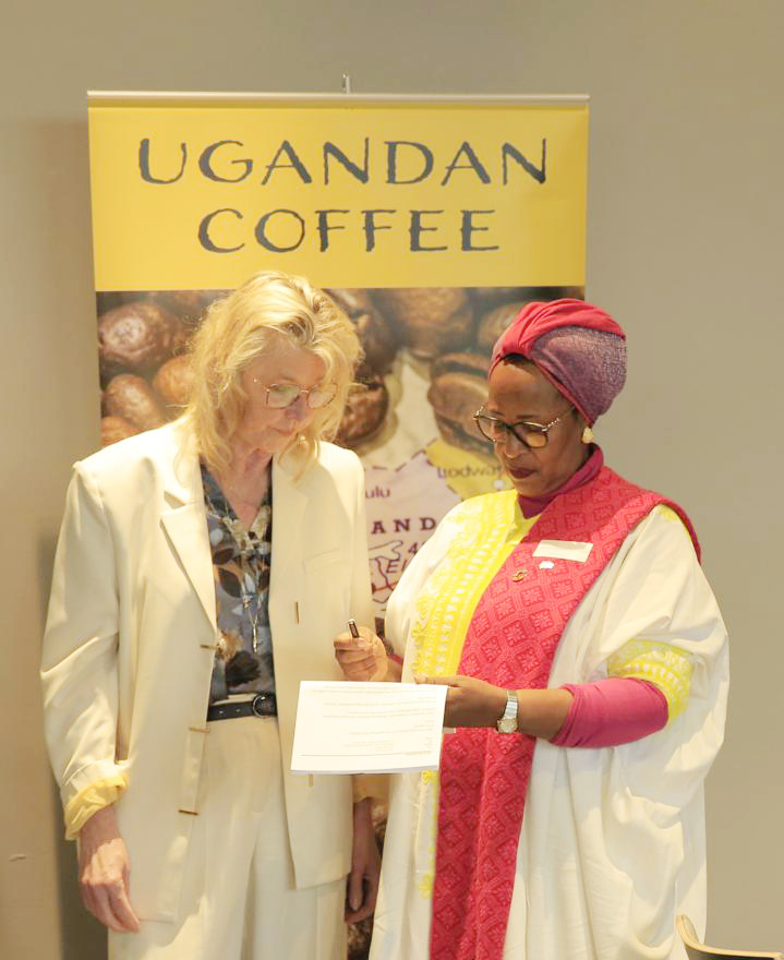 Ambassador Margaret Otteskov (right) interacting with one of the participants during the tourism symposium in Denmark. (Courtesy photo)