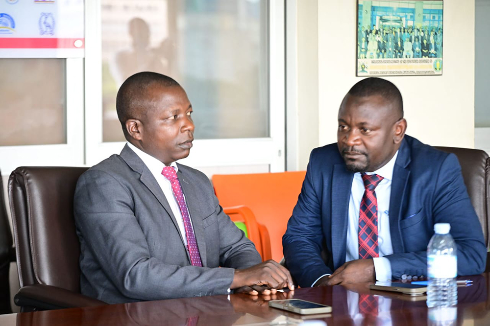 Rajab (right) interacting with an IGG official. (Courtesy: IGG)