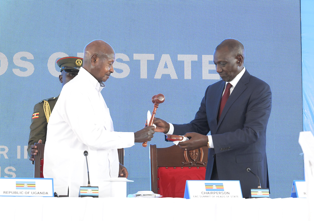 President Yoweri Kaguta Museveni with Kenya's William Ruto during the process of assuming Chairmanship of the East African Community (EAC) Summit on Saturday, March 7, 2026. (Courtesy)