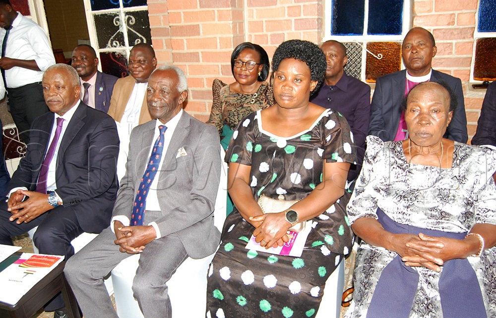 Rt. Hon. Amama Mbabazi (left), Rtd. Justce James Ogoola (second-left) and other Crhristians during the memorial prayers. (Photo by Mathias Mazinga)