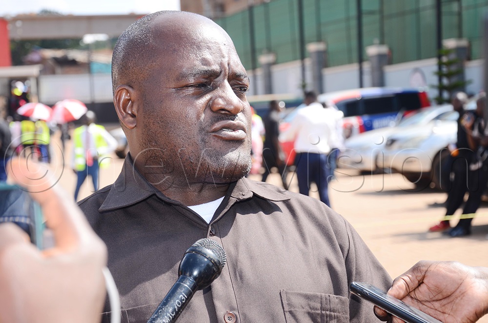 NUP electoral management committee (EMC) member for Buganda, John Mary Ssebuwufu addressing the media. (Photo by Isaac Nuwagaba)