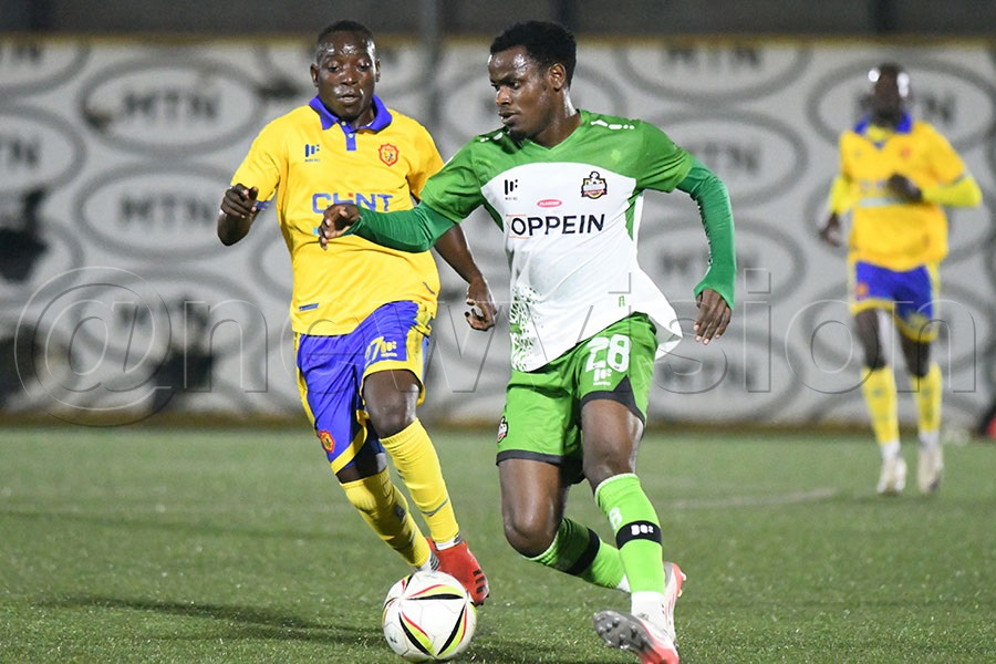 NEC FC's Emmanuel Nkuranga (right) beats KCCA FC's Lazaro Muhindo during a UPL match at the Phillip Omondi Stadium, December 12, 2025. Photo by Michael Nsubuga