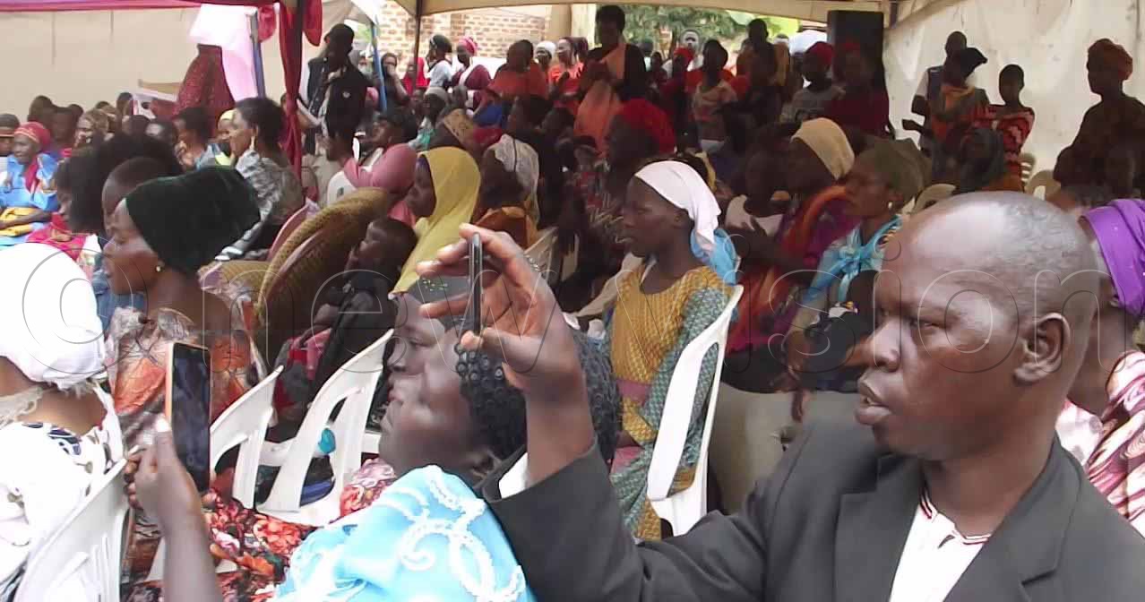 Some of the guests who sat for hours waiting for the ceremony to get started. Photo by Henry Nsubuga