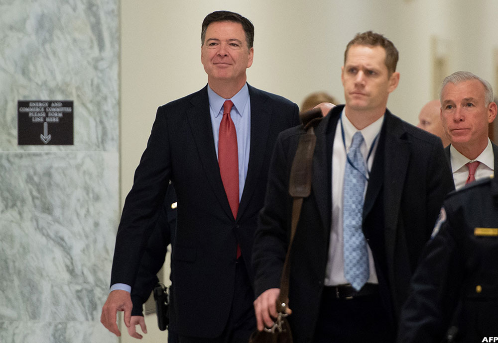 Former FBI Director James Comey (L) arrives to testify during a closed House Judiciary Committee meeting on Capitol Hill in Washington, DC, December 17, 2018