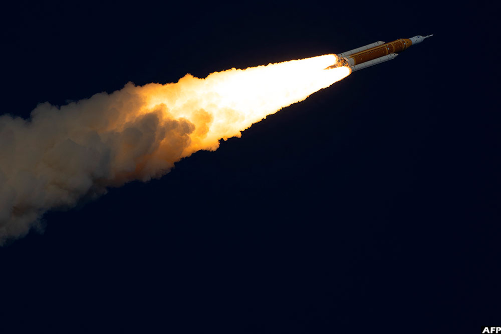 NASA Orion program manager Howard Hu (R) and acting associate administrator for NASA’s Exploration Systems Development Mission Directorate Lori Glaze (L) listen to NASA flight director Judd Frieling (C) speak during a status briefing of the Artemis II crewed lunar mission at Johnson Space Centre in Houston, Texas, on April 2, 2026.