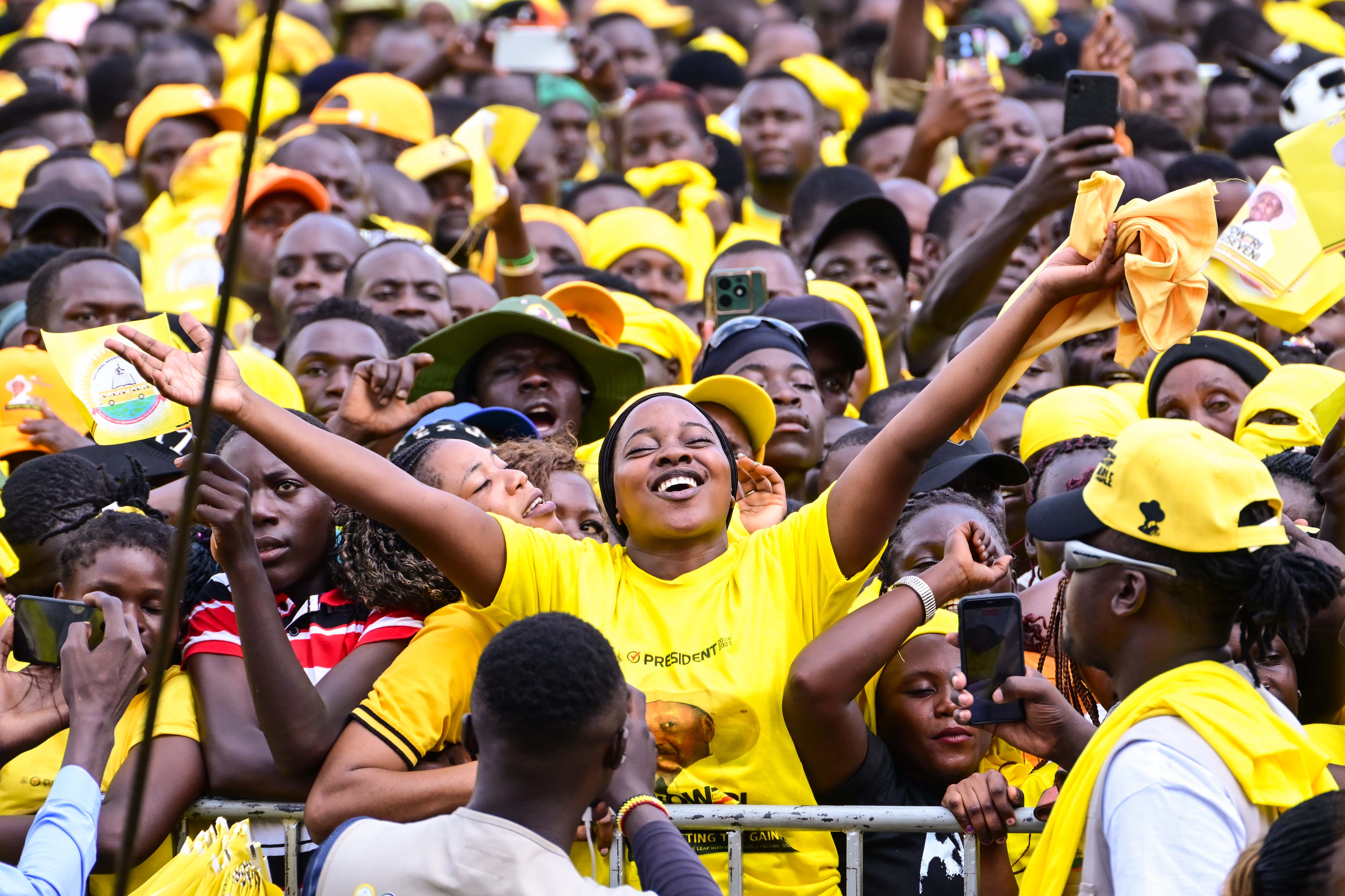 An NRM supporter in Mukono district expresses her excitment as they listened to President Museveni's campaign address during a rally at Naggalama in Mukono district on Friday.