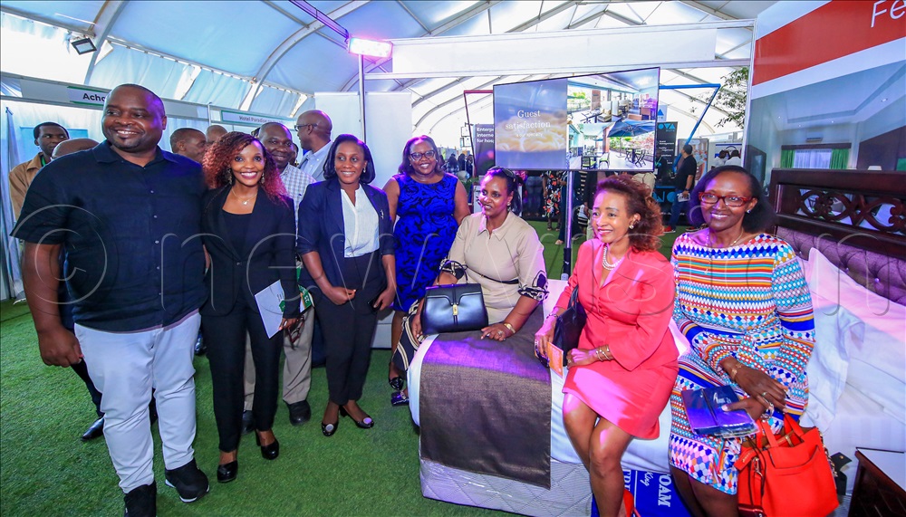Suzan Muhwezi, the chairperson Uganda Hotel Owners Association, with some of the exhibitors during their expo.