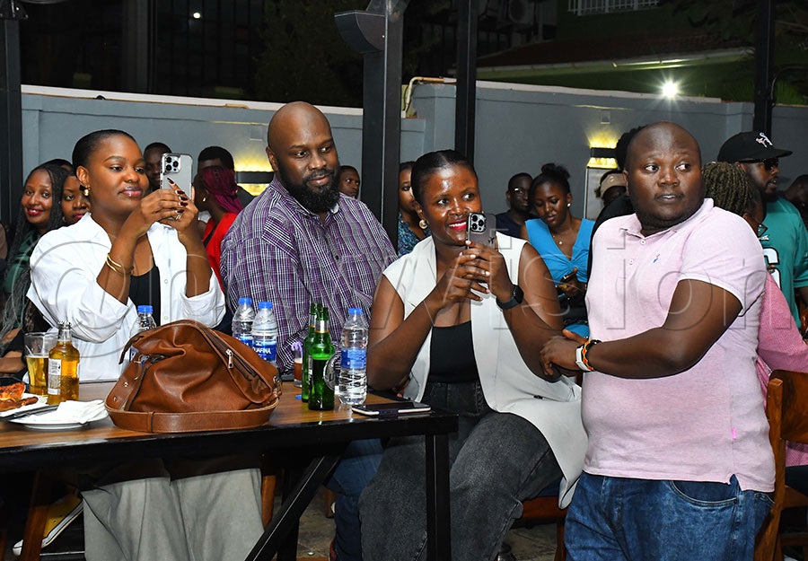 Fans enjoying The Mith's Bali Okwabwe album. Photo by Ignatius Kamya