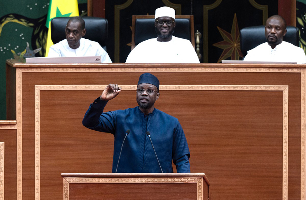 Speaker of Senegal's parliament El Malick Ndiaye (back, centre) reacts as former Senegalese Prime Minister Ousmane Sonko delivers his adress at the national Assembly in Dakar in November last year. (AFP Photo)