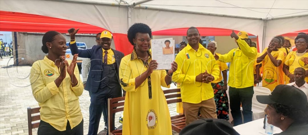 Lillian Aber (sate for disaster relief and preparedness) who seeks to retain her position as Kitgum Woman MP showing her nomination form after she was declared a candidate.