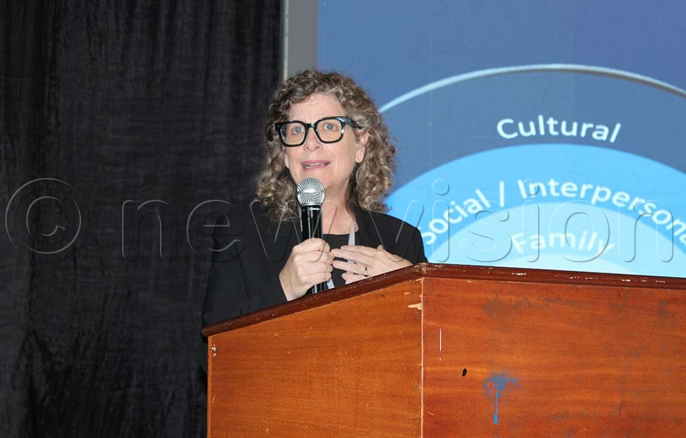 Jennie Noll, Executive Director of Mount Hope Family Center at the University of Rochester speaking at the child-focused research symposium at the Golf Course Hotel in Kampala today. (Credit: Bridget Ahurira)
