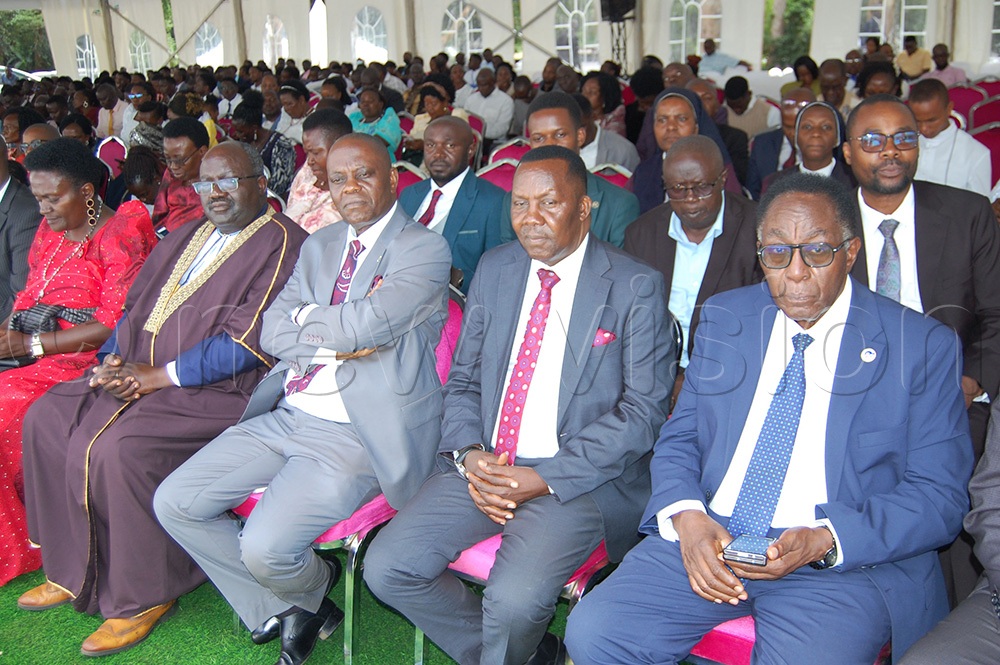 Prof. John Ddumba Ssentamu (right) with other dignitaries during Mass. (Photo by Mathias Mazinga)