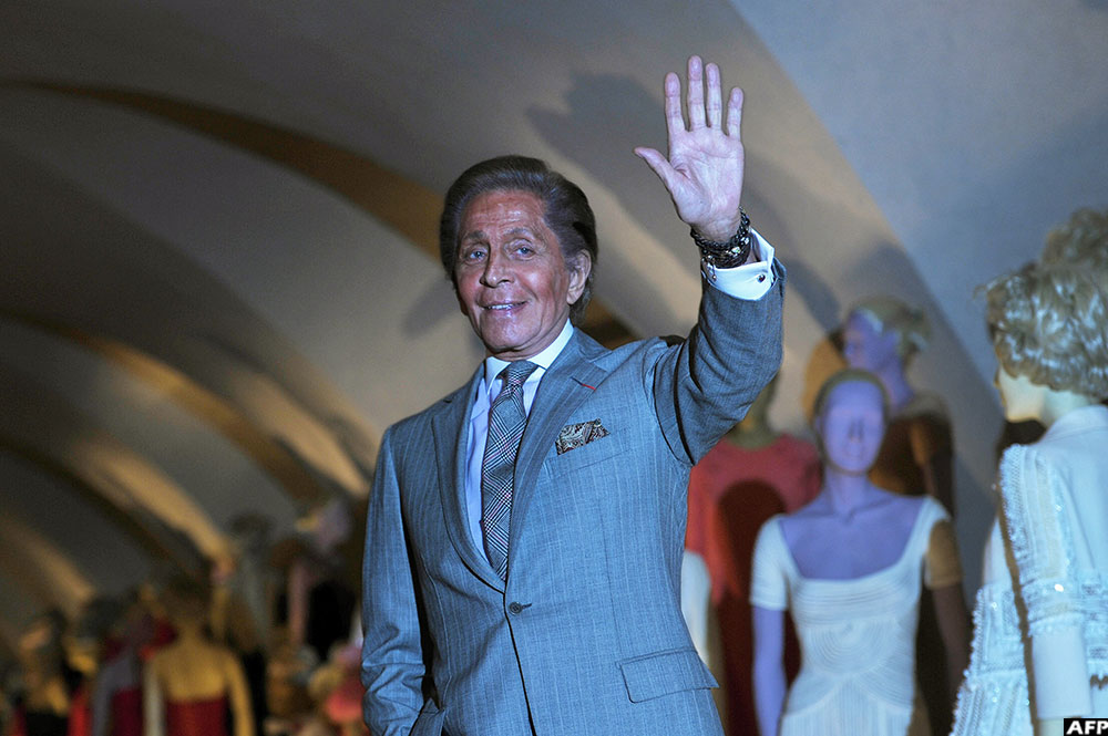 On November 28, 2012, Italian couturier Valentino Garavani poses for photographs at the launch of his exhibition 'Valentino: Master of Couture' at Somerset House in central London.