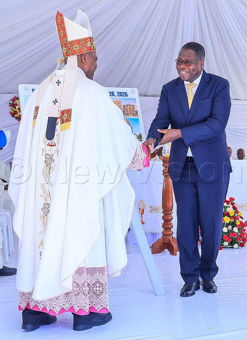 Speaker of Parliament Jacob Oboth greeting Archbishop Lambert Bainomugisha. (Credit: Bruno Mugizi)