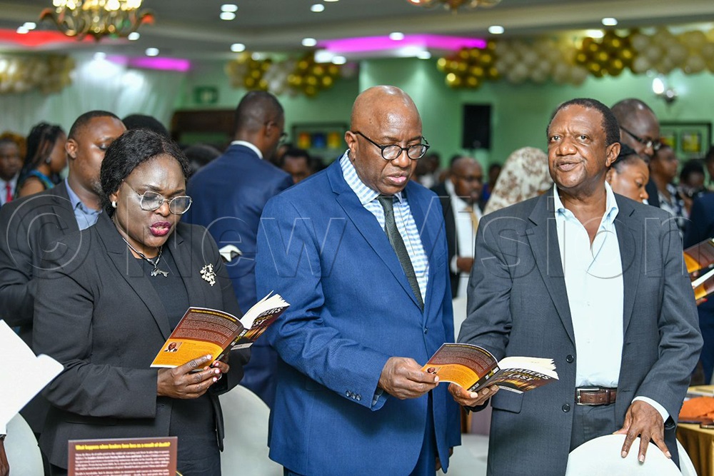 Guests sing a hymn from the book.