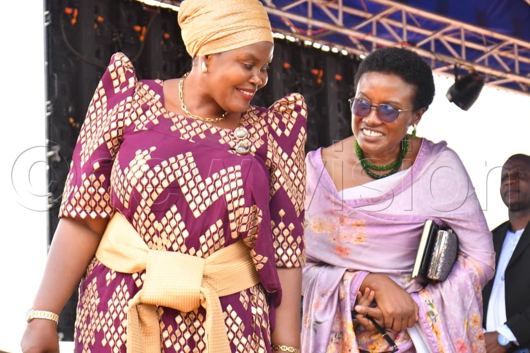 Third Deputy Prime Minister Rukia Nakadama interacts with the State Minister for Gender and Culture, Mary Grace Kuteesa.
