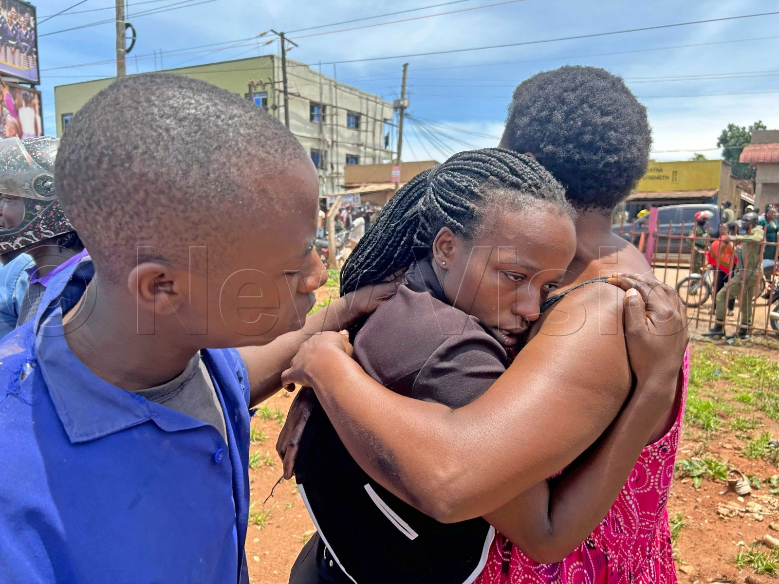 A lady being consoled after the shocking incident.