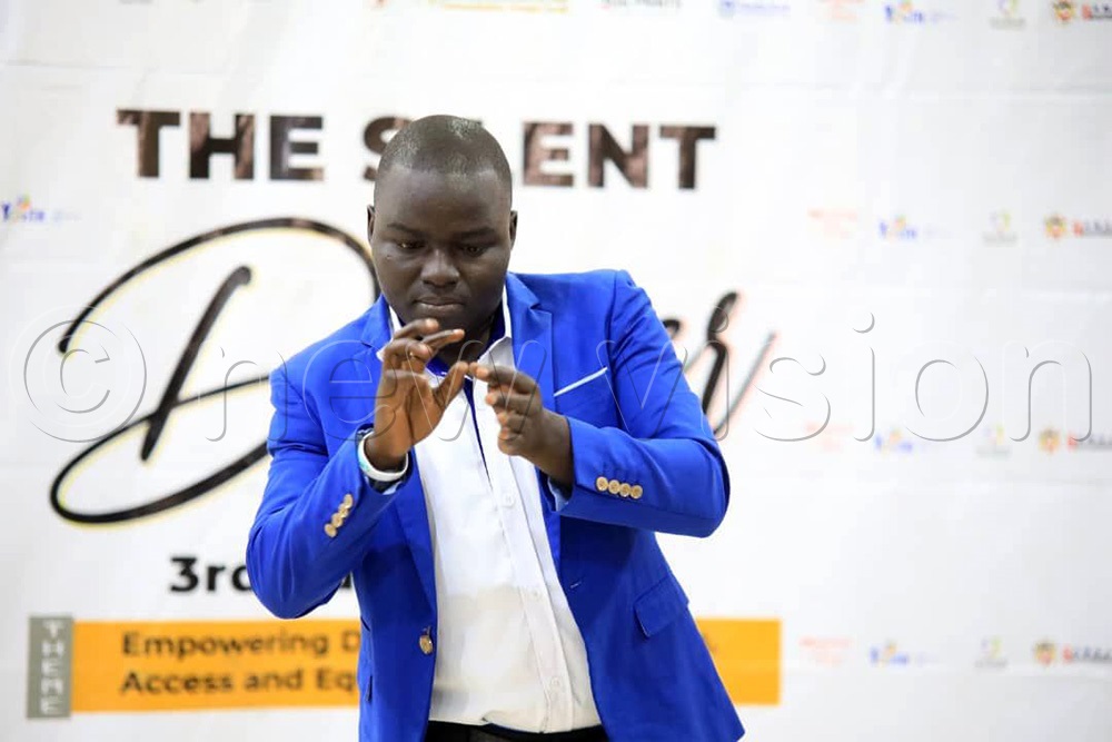Alex Ogwal,  CEO of Sign Language for All (SLFA) making his remarks. (Photo by Ritah Mukasa)