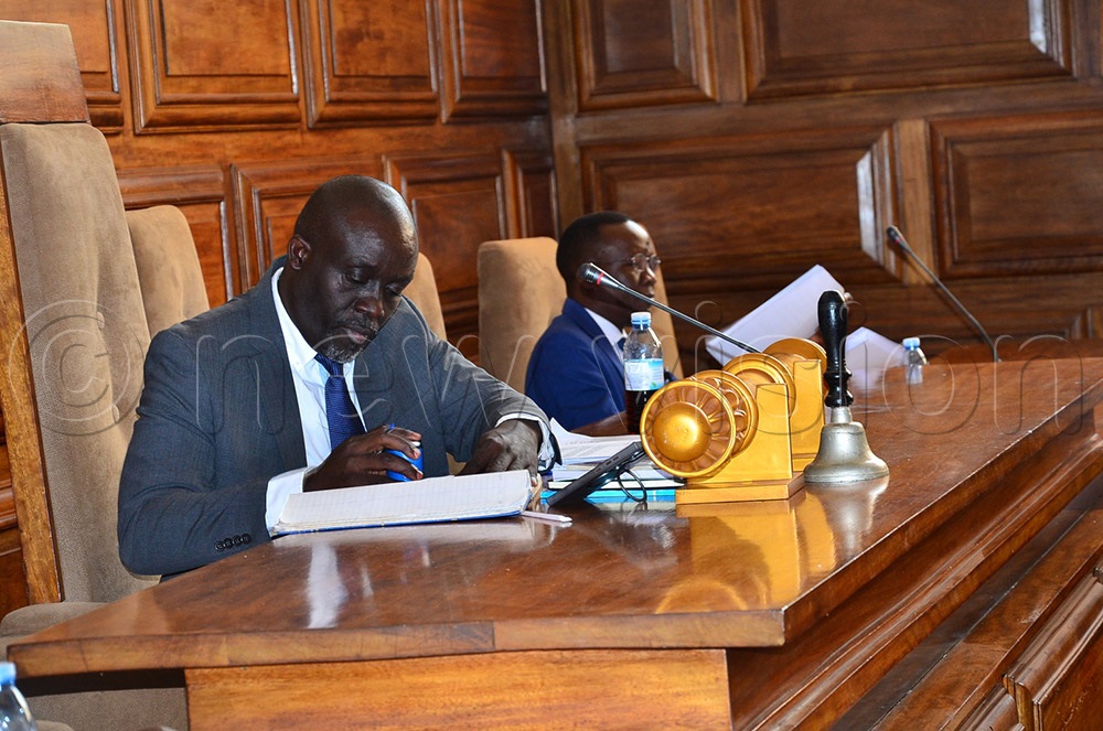 Walking the talk, Mbayo signed last in the attendance book after adjourning the council meeting on Friday in which he vowed not to allow absentee councillors from appending their signatures for pay. (Credit: Jackie Nambogga)