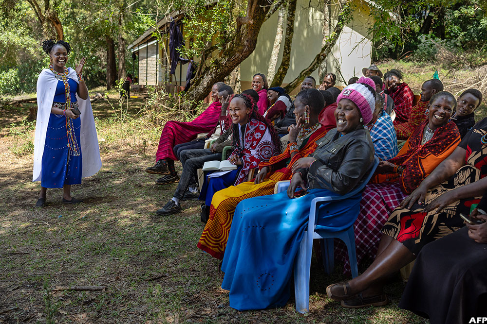 Members of the Maasai community, including reformed FGM practitioners, anti-FGM activists, and community leaders, take part in a dialogue against FGM and child marriage in Loita Ward, Narok County. (AFP)