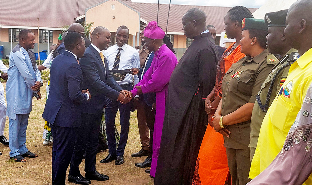 The deputy speaker Thomas Tayebwa greeting the Bishop of Madi-West Nile Diocese, Rt Rev. Charles Collins Andaku at the thanksgiving ceremony of Arua City Mayor-elect Lawrence Alionzi. (Photo by Robert Adiga)