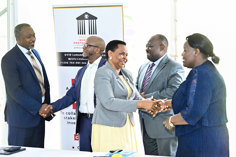 (Left-right) Uganda Manufacturers Association (UMA) Executive Director Dr. Ezra Muhumuza Rubanda, National Environment Management Authority (NEMA) Executive Director Barirega Akankwasah, State House Investors Protection Unit (SHIPU) head Col. Edith Nakalema, Uganda Wildlife Authority (UWA) Executive Director Dr. James Musinguzi and Electricity Regulatory Authority Chief Executive Officer Eng. Ziria Tibalwa Waako having a chat after an engaging meeting of the Heads of Government Agencies on Uganda’s Development Agenda at the SHIPU headquarters in Nakasero Kampala on the 19th August 2025. 