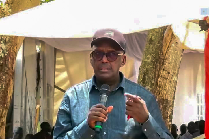 Former security minister Lt Gen Henry Tumukunde said as he struggled to hold back tears that were rolling down his cheeks during the burial of Dennis Busulwa. (Courtesy photo)