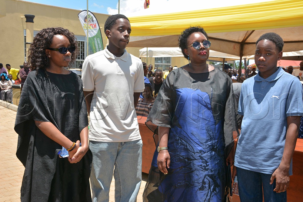 The deceased’s wife, Mebo Ajuna, and the orphans during the funeral of their fallen father, Banura. (Credit: Peter Abaanabasazi)