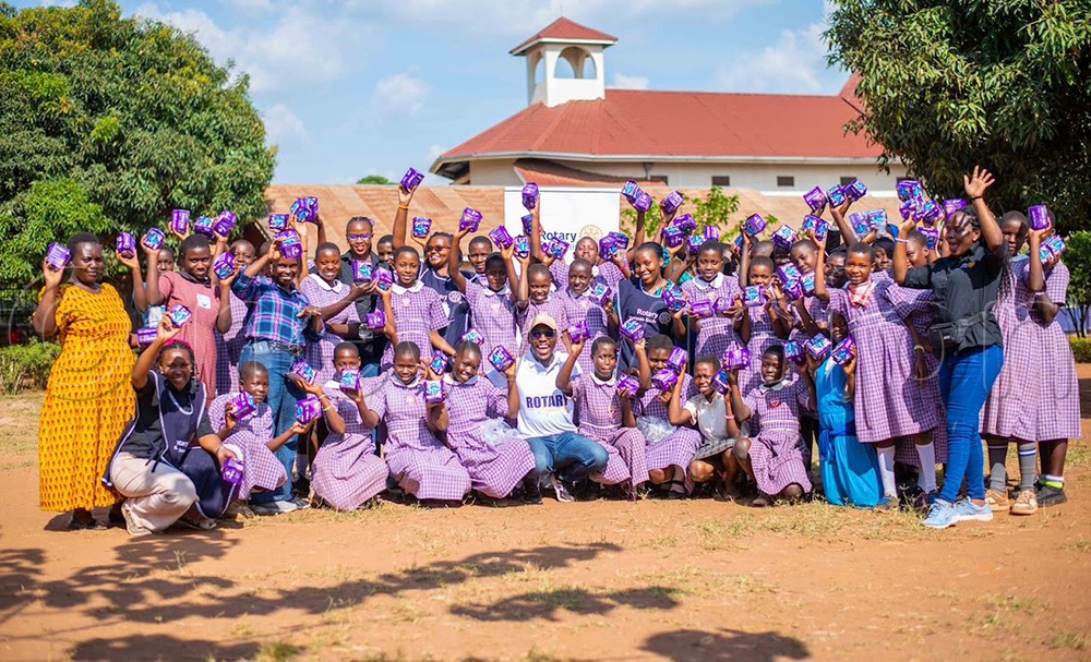 The club also distributed sanitary pads to St Mark Primary School pupils. (Credit: Richard Ategeka)
