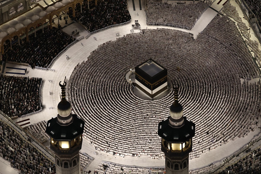 Muslims perform the evening prayer around the Kaaba, Islam's holiest shrine, at Grand Mosque complex on May 24, 2026, ahead of the annual Hajj pilgrimage. (Credit: AFP)