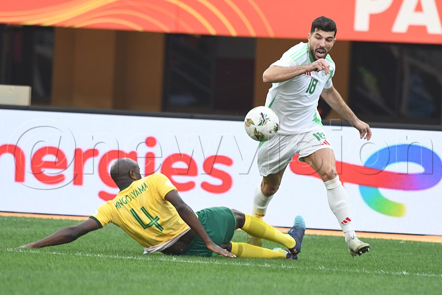 South Africa 's Kwandakwensizwa Mngonyama (left) tackles Algeria's Aimen Mahious during a CHAN Group C match at Namboole, August 8 2025. Photo by Michael Nsubuga