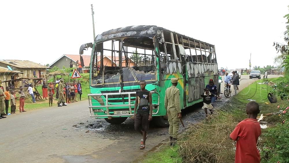 The bus wreckage at the scene. (Credit: Jonan Tusingwire)
