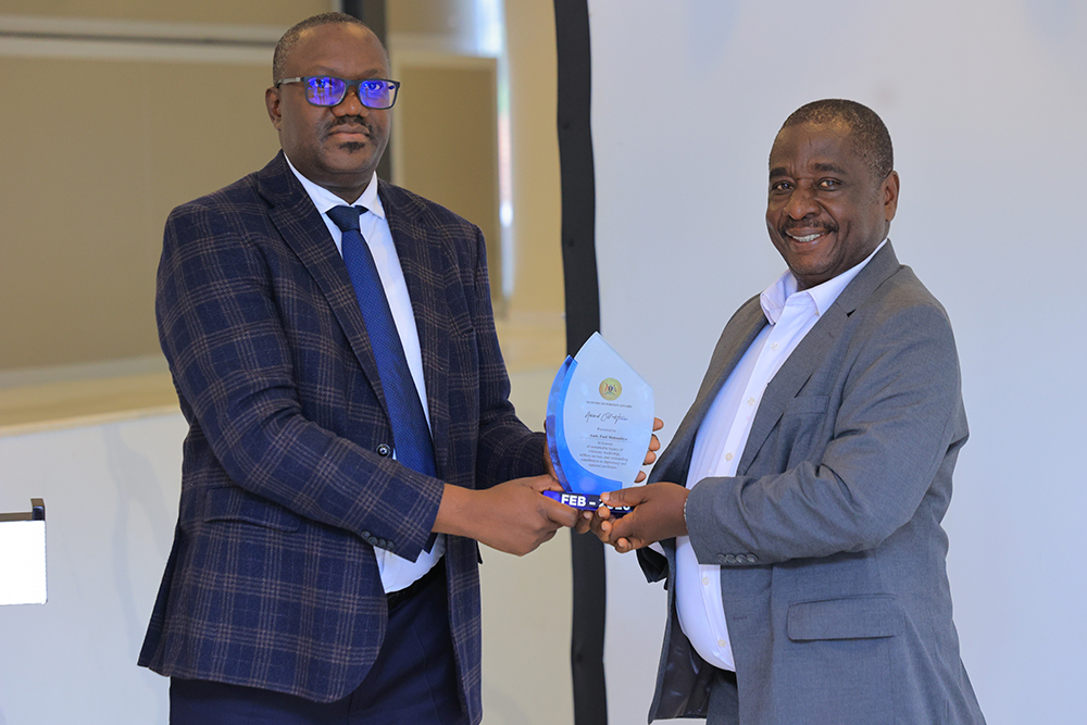 Permanent Secretary, Mr Bagiire Vincent Waiswa with Amb. Paul Mukumbya. (Courtesy)