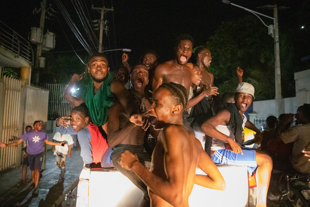 Fans cheer in the streets of Port-au-Prince on November 18, 2025 as Haiti celebrates its victory over Nicaragua and qualification for the 2026 FIFA World Cup. Haiti, who last appeared in the World Cup in 1974, completed an improbable qualification campaign with a 2-0 win over Nicaragua.