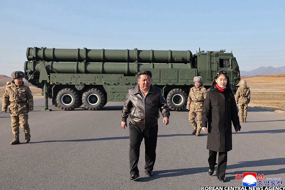 North Korean leader Kim Jong Un and his daughter Kim Ju Ae inspecting a test firing of the renewed large-calibre rocket launcher system, at an undisclosed location in North Korea 