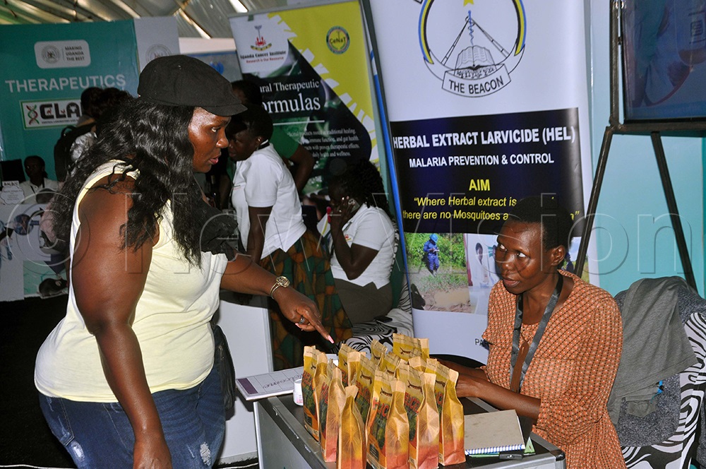 Abonyo talking to clients during National Science Week 2026, at Kololo Independence Grounds in Kampala. (Photo by John Odyek)