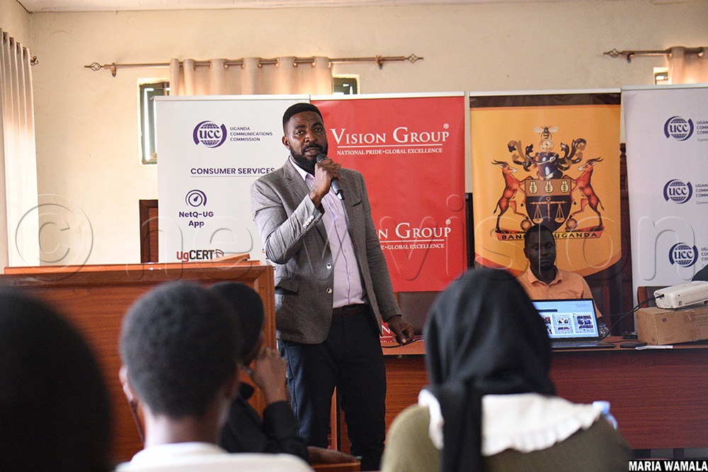 Emmanuel Muyomba, the head regional officer at UCC talking to students about the Ultimate University Quiz Challenge. (Photo by Maria Wamala)