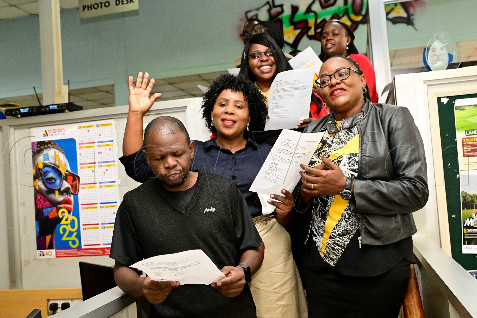 Vision Group staff singing praise to God during the prayer and thanksgiving.