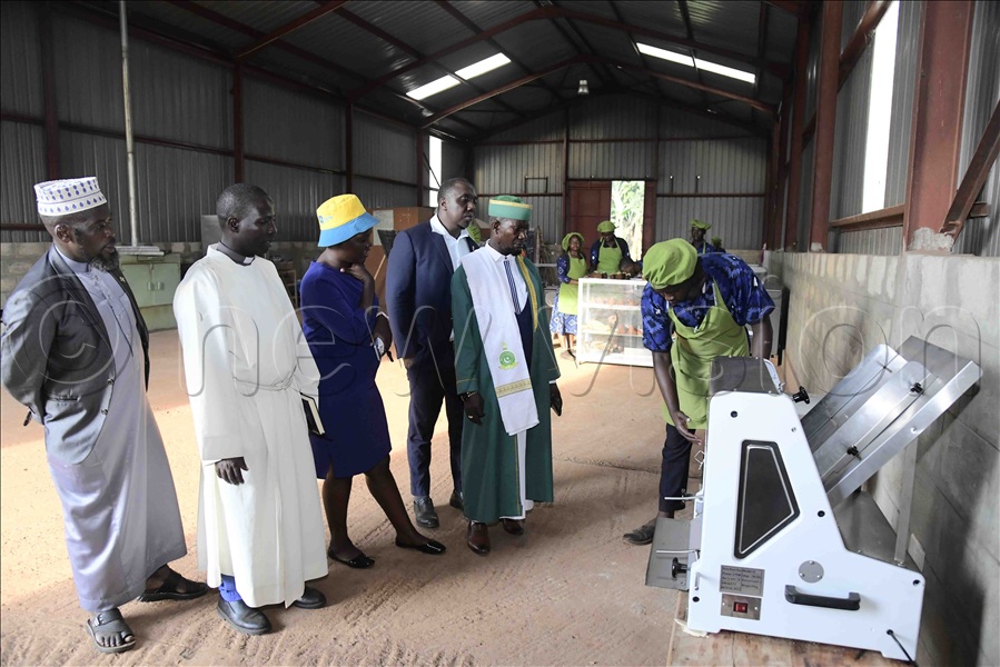 A trainee of the Busoga Presidential Skilling Hub from the bakery department shows some of the modern machines they use in making their products to the visiting Bugweri district religious leaders.