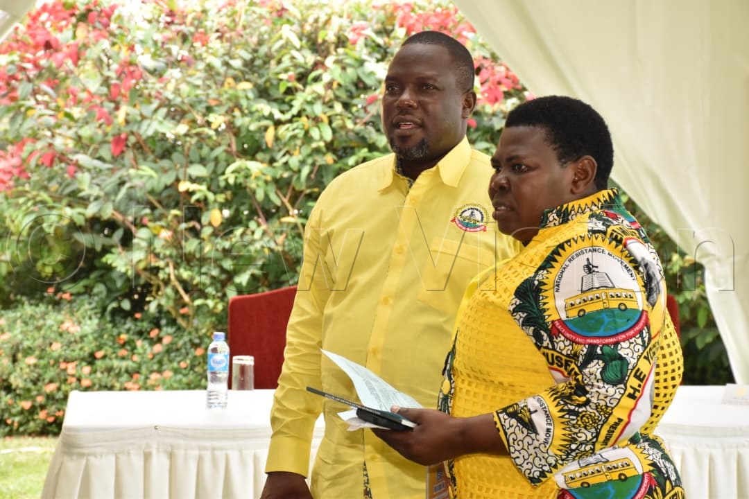 Richard Todwong, the NRM secretary general, sharing a light moment with Rose Namayanja, the deputy secretary general of NRM.